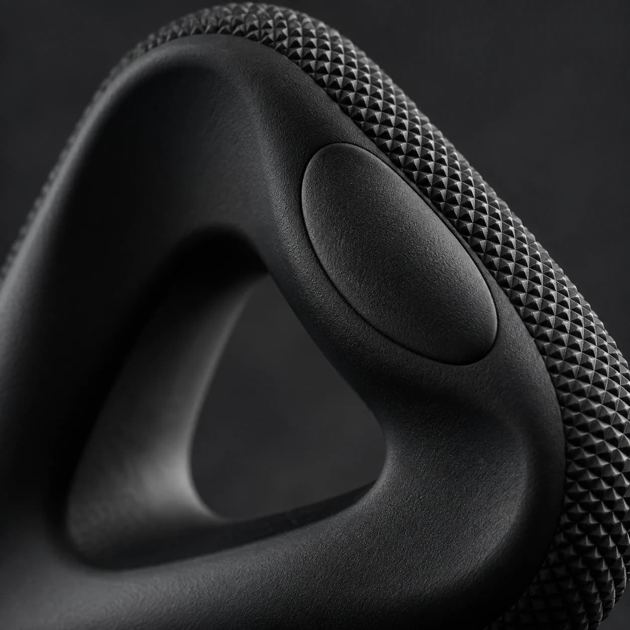 The fine tactile texture and three-sided form of a black GRIPLR trainer